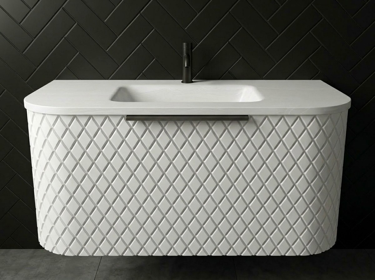 Maryfass White Diamond Corian bathroom vanity with geometric textured facade and integrated seamless sink against a white tiled wall.